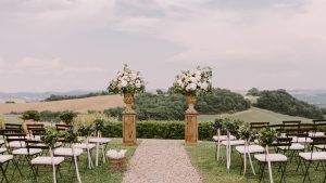 Scenic outdoor ceremony setup at one of the top wedding venues in Raleigh NC with floral arrangements and countryside views.